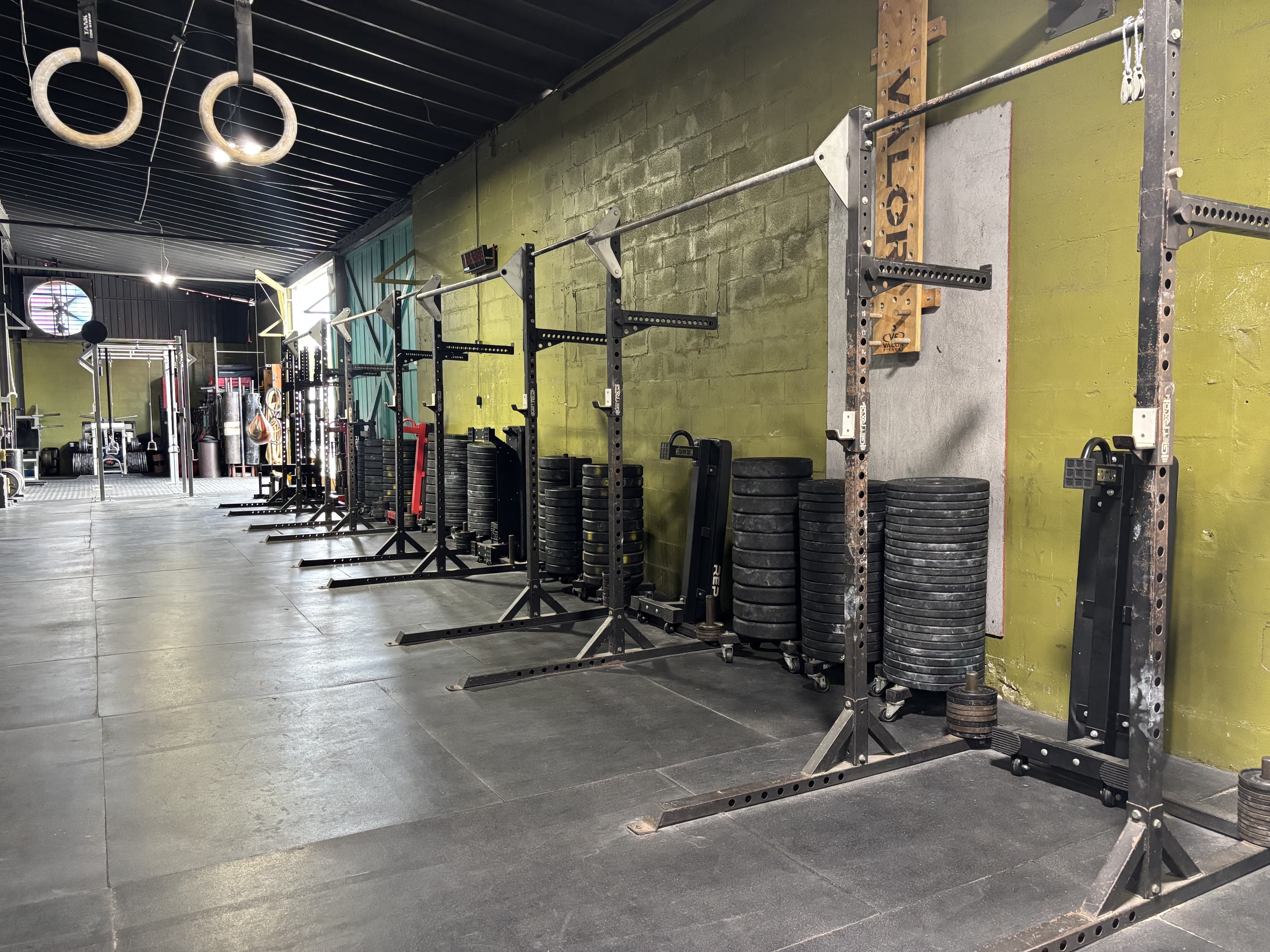 Row of squat racks down the length of the Havoc floor